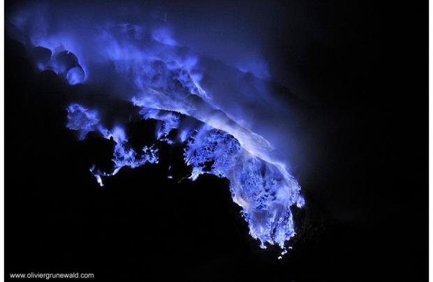 The blue lava results from concentrated amounts of sulfuric acid in mountain that--when melted--release the sulfuric acid into air; when the air is in excess of 359 celsius, the chemicals combust into the blue flames you see in these pictures.
