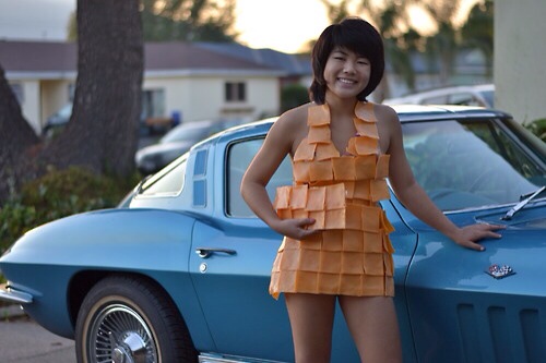 Girls Wearing Cheese as Dresses and Posing In Front of Cars