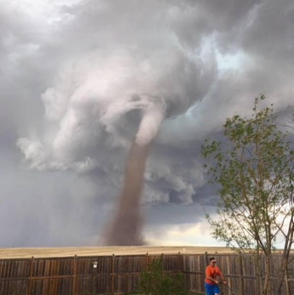 man mowing lawn with tornado