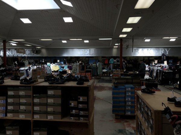 If you look closely into this shoe store, you can see the Deli and Bakery signs from an old grocery store.