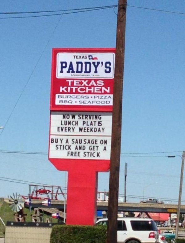 street sign - Texas Paddy'S Texas Kitchen Burgers. Pizza Bbq . Seafood No W Serving Lunch Plate Every Weekday Buy A Sausage On Stick And Get A Free Stick
