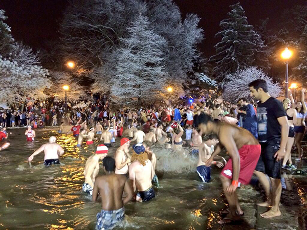 OHIO STATE: THE MIRROR LAKE JUMP-Since 1969, Buckeye fans have celebrated the game against Michigan's rival Wolverines by jumping into a freezing-cold oversized pond on the OSU campus, and since 1970 OSU has been trying to stop them. After the tradition blew up in 1990, the university took steps to curb the tradition (estimated to cost the school $20k in cleanup costs annually): it's officially discouraged, cops are present (though they rarely make arrests), and the negative effects of jumping into icy water polluted by hundreds of drunk college students' piss are heavily publicized. OSU gave up in 2013 and made the event semi-official, requiring wristbands, supervision, and hopefully less piss-based diseases