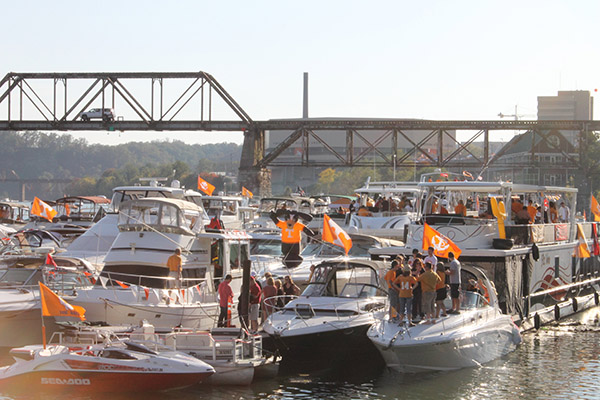 UNIVERSITY OF TENNESSEE: THE VOL NAVY-For the last decade or so the Volunteers' best-known tradition has been sucking in hilarious ways (check the recent loss to Oklahoma, where the Vols played exactly one half of a great game before just sort of losing interest) but the Vol Navy has been around since 1962, when former Tennessee announcer George Mooney found an ingenious solution to Knoxville's nightmarishly bad gameday traffic: simply boat down the Tennessee River to Volunteer Landing and walk five or so blocks to Neyland Stadium. Today, the Vol Navy boasts 200 vessels, many of which are fancy luxo-yachts whose owners choose to watch the game on ship and avoid contact with the drunken hipsters and penniless bloggers that infest Knoxville's Fort Sanders neighborhood.