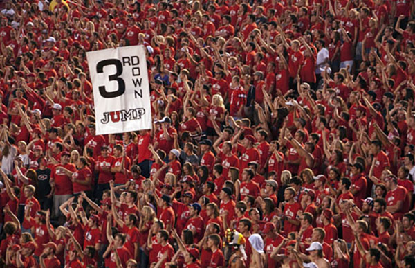 UNIVERSITY OF UTAH: THE MUSS-It started in 2002 but is one of the most well-known college football traditions today. U of U's Mighty Utah Student Section is a testament to Utahns unsettling skill at acting like a single hive-mind entity. Derived from a lyric in the school's old-timey fight song ("No other gang of college men dare meet us in the muss"), MUSSers wear customized red t-shirts, stand throughout the entire game, and most famously perform the Third Down Jump to distract and intimidate the other team on crucial third down plays. The MUSS is so good at what it does that they keep a running tally of false starts committed by the other team; in 2011 alone they racked up 25 five-yard penalties.