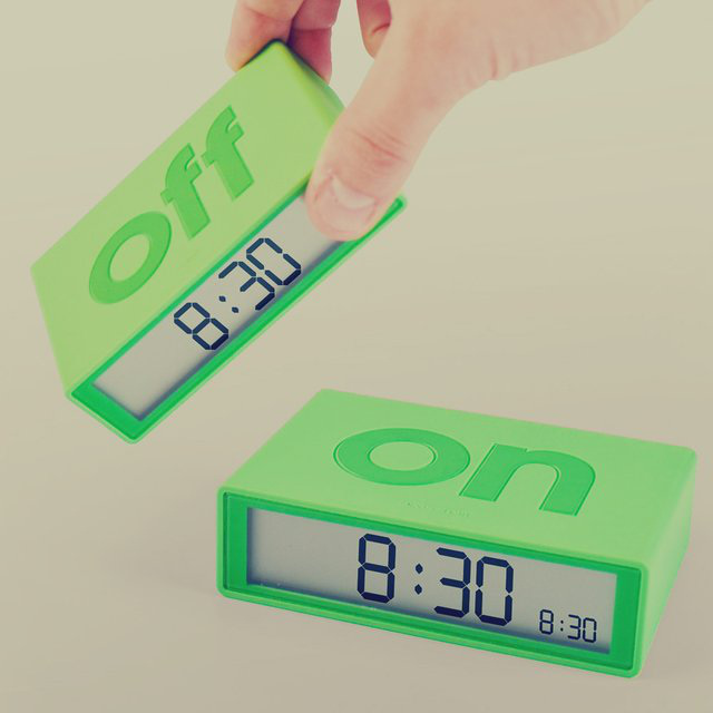 Flip On/Off Alarm Clock –
Never question if your alarm is set again by grabbing this Lexon Flip On/Off Alarm Clock. The concept is simple. When the alarm has the large word “On” on top, your alarm is set. When the word “off” is on top, the alarm is off. When your alarm goes off in the morning, just turn the clock over to shut it off, or touch it to set a short snooze.