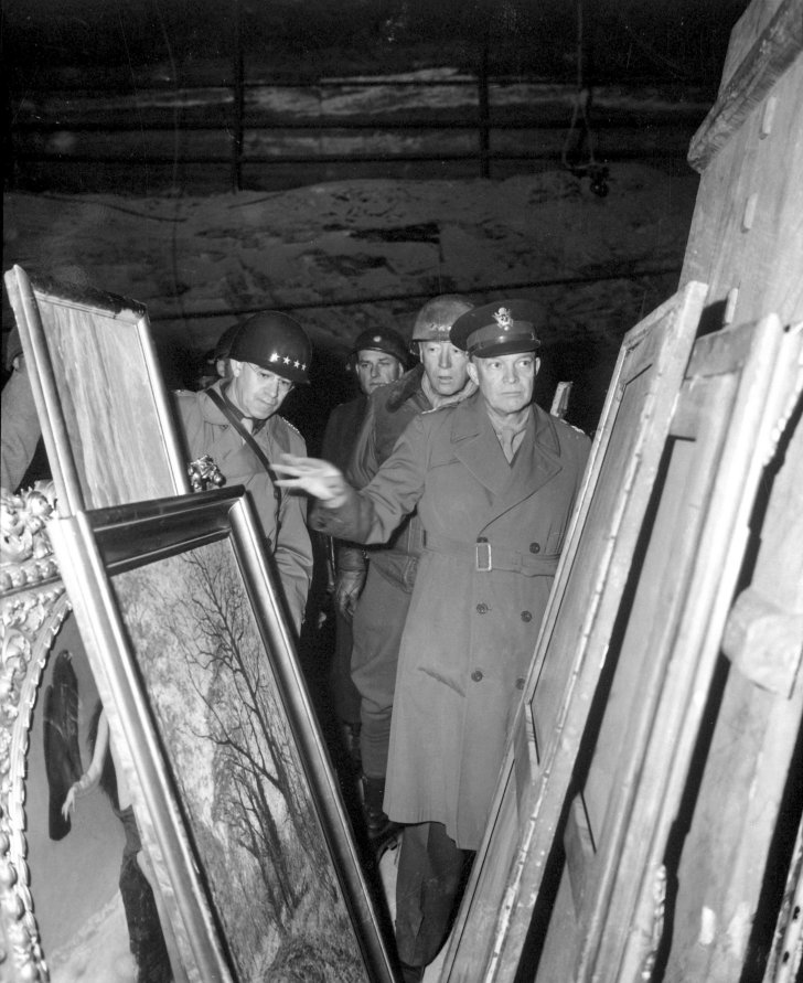 Eisenhower and Patton examine a trove of stolen artifacts that the Germans hid in salt mine in 1945.
