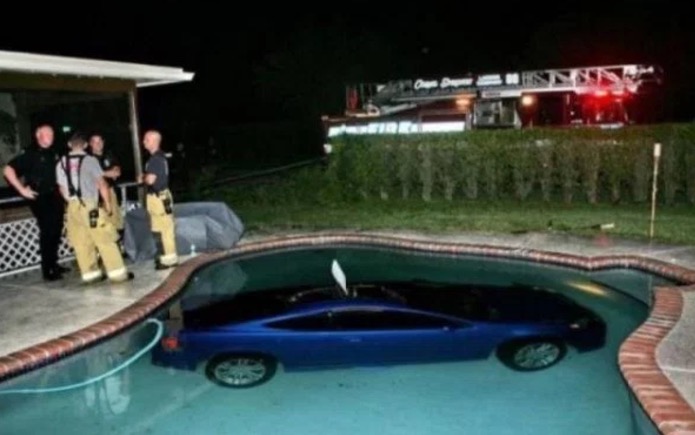 Funny picture of a car that is at the bottom of a pool.