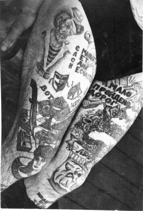 On his right leg is the acronym ‘SLON: S malih Let Odni Neschastya,’ which translates to ‘Only Misfortunes from an Early Age.’ Text under this reads ‘Here is what [is killing us].’ The dagger, cards and money are a variation of the popular tattoo ‘These are the things that destroy us.’ Text at the top of the left leg reads ‘Few roads have been walked.’ Text by the knee reads ‘Love.’ Text on the shin reads ‘It [the leg] walks around the zone.’ The theatre masks on the right leg represent happiness (before prison) and sadness (after prison).