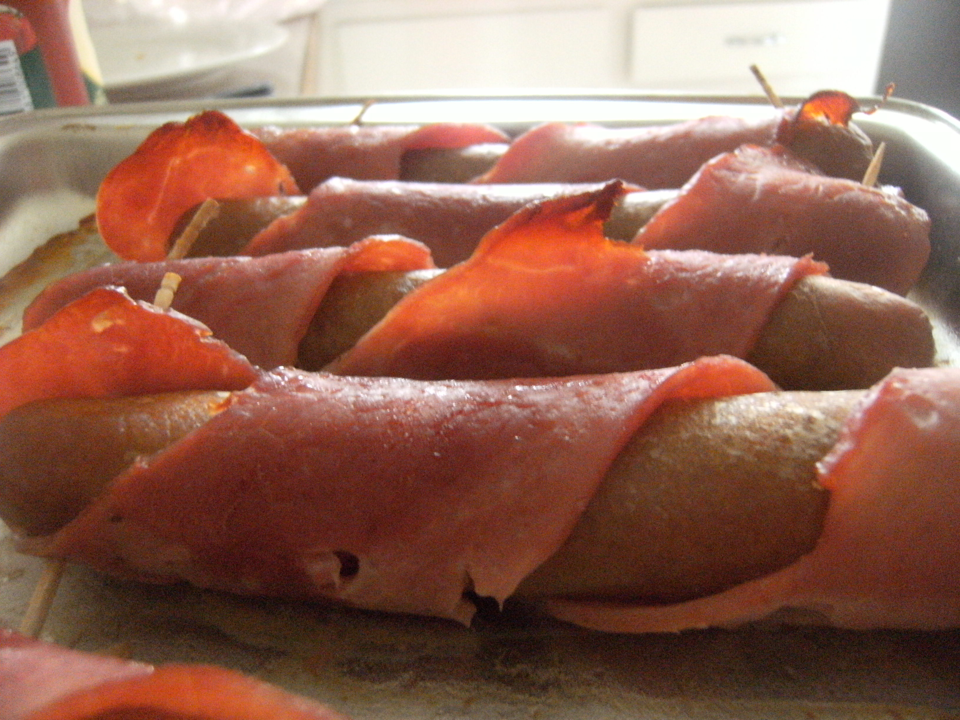 Sausages wrapped in bacon! Shoulder Bacon, for you assholes who don't know better