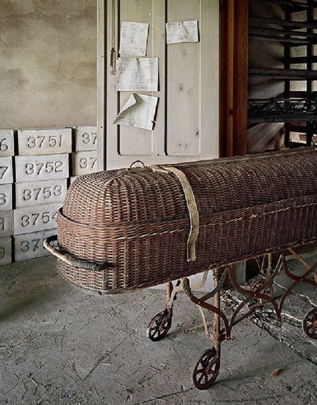 Abandoned state hospital, casket and grave markers...