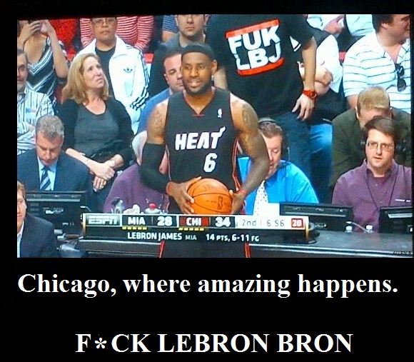 A funny wise guy from Chicago decided to stand up behind lebron when the camera was on him with a FUK LBJ shirt on. PRICELESS
