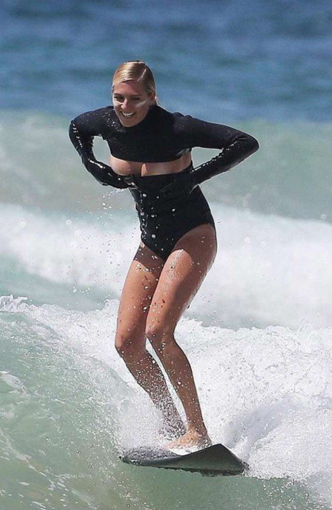Surf champ Stephanie Gilmore...can’t help but laugh as her swimsuit goes in two different directions during her performance.