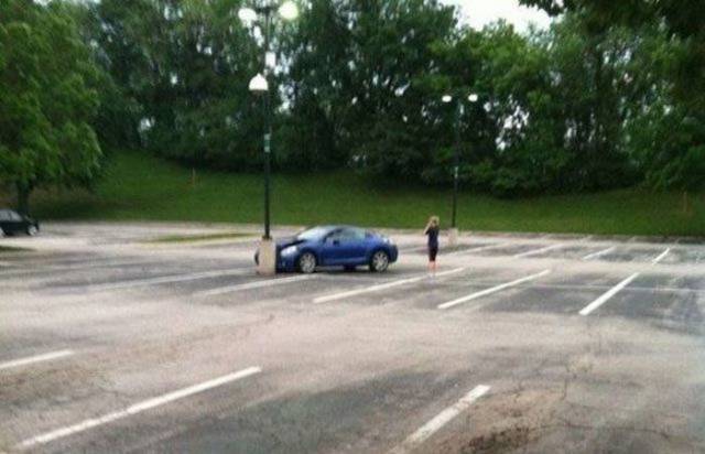 woman driving car crash in empty parking lot