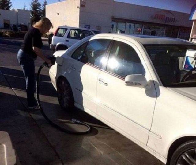 woman driving drove off with the gas pump