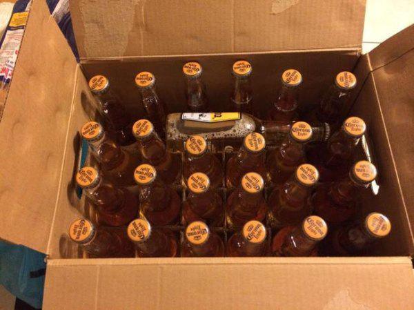 A package with an extra stray bottle of beer.
