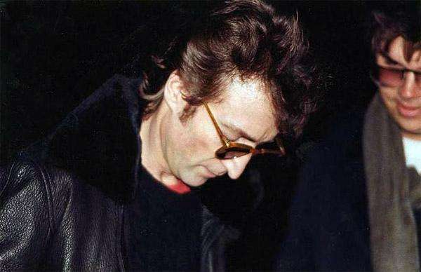 John Lennon - 
Signing an autograph for Mark David Chapman, who murdered him several hours later on December 8, 1980.