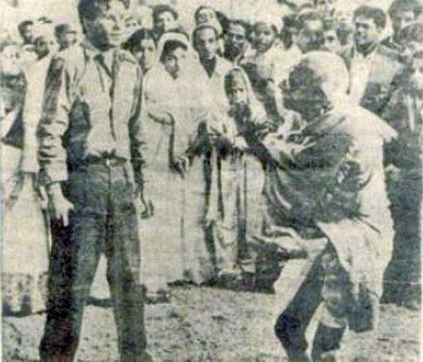 Mahatma Gandhi - 
Making his way through a crowd when confronted by his assassin, Nathuram Godse, who shot him three times in the chest on January 30, 1948