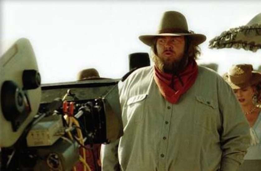 John Candy - 
Candy suffered a heart attack while filming Wagons East in Durango, Mexico on March 4, 1994. This photo was taken on the set of the film.