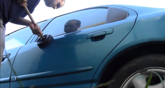Use a plunger, yes a plunger, to remove small dents from your car.