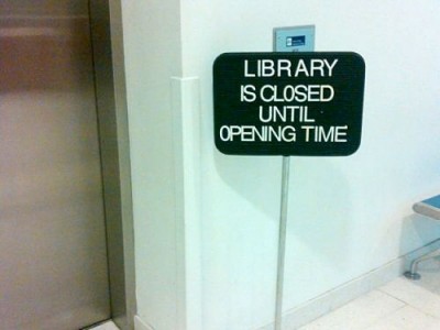 signage - Library Is Closed Until Opening Time