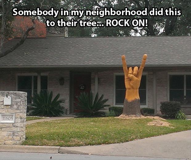 tree carved rock on austin - Somebody in my neighborhood did this to their tree... Rock On! 11605