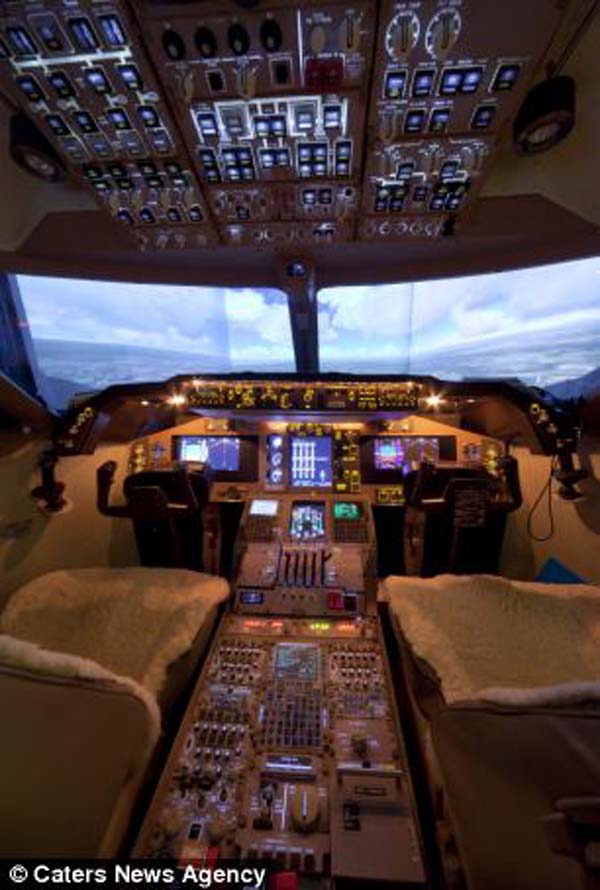 In order to build the plane, John had to study photographs of a Boeing 747-400 cockpit online.