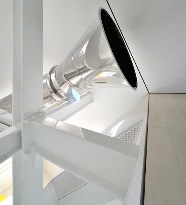 Instead of taking stairs to get around this massive apartment, you take the slide.