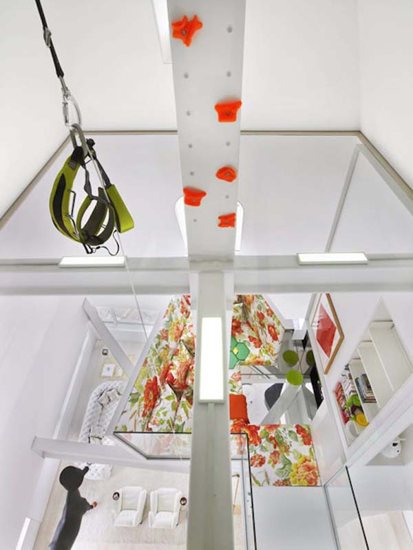Skyhouses design mixes fun in with modern ideas. Theres a rock wall, a swing