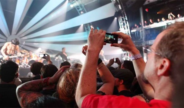 Cameragoer - A person who prefers to view a live musical performance through the screen of his or her camera phone, thus blocking the view of the concert goers behind the camera.