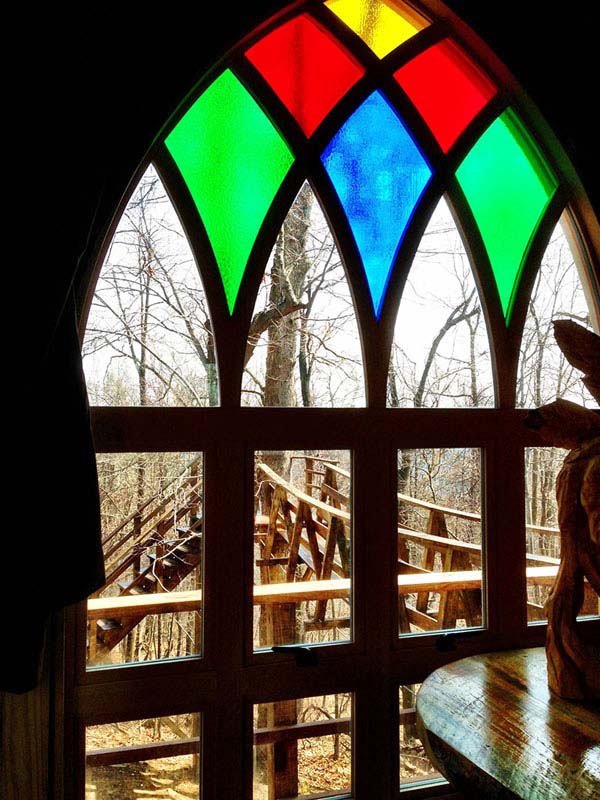 It features Gothic stained glass windows.
