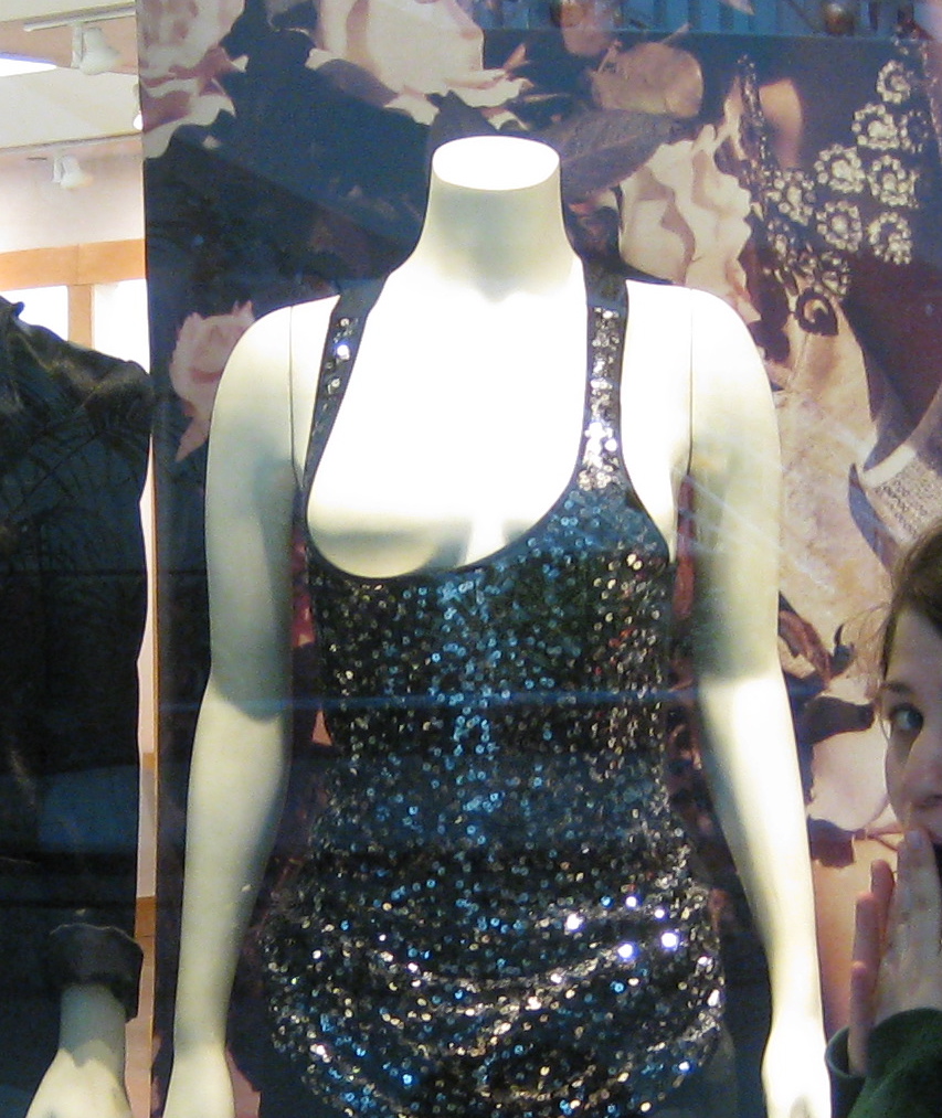 dress on a mannequin shows one boob