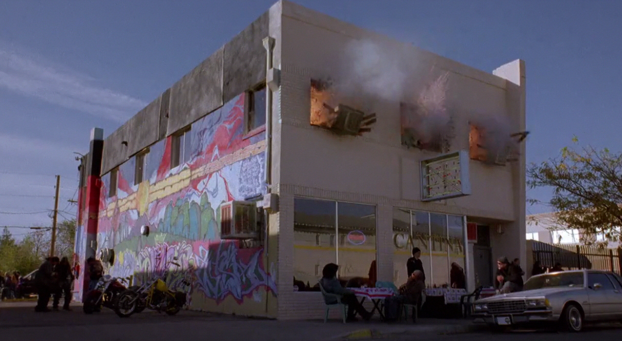 Inside Tuco's office, why is it that Walt is the only one uninjured when he threw the explosive on the floor? It was so powerful the windows blew out, yet Walt was still Ok.