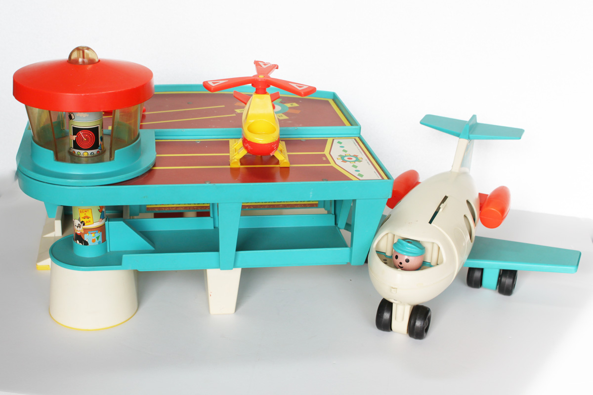 Fisher Price toys. They had this one, a fire station, and a  parking ramp. All blue collar toys so your kids don't get any funny ideas about ever being rich and successful.