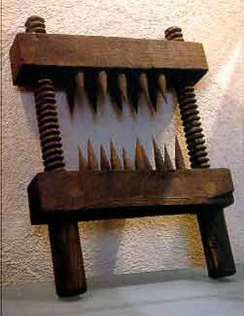 The whole purpose of this device was to make a persons knees useless. It was used in mainly during the Inquisitional period of time. This device was faceted with spikes, from three to twenty of them, and depending on the crime committed, depended on the number used. IT had a handle the torturer would use to close the device. The spikes would mutilate the skin and begin to crush the knee. They would also use the device on elbows, arms and the lower legs
