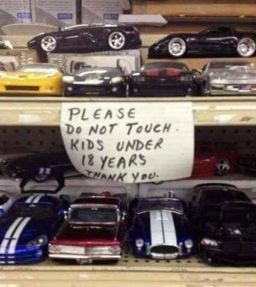 Sign against touching the merchandise appears to be asking you to not touch underage children