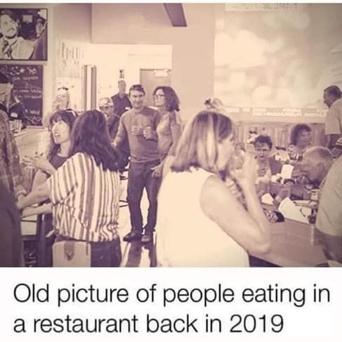 friendship - Old picture of people eating in a restaurant back in 2019