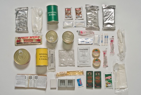The Italian ration pack contains a breakfast shot of 40 alcohol cordiale, a powdered cappuccino, lots of biscotti, and a disposable camping stove for heating parts of the meal, including a pasta and bean soup, canned turkey and a rice salad. Dessert is a power sport bar, canned fruit salad or a muesli chocolate bar.