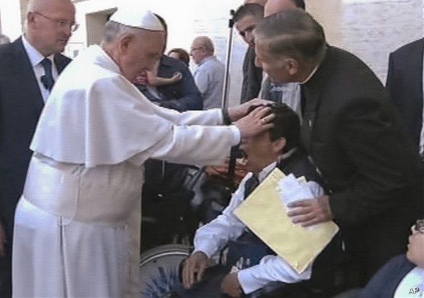 Pope Francis is so powerful...he spontaneously exorcised this young man.  Either that, or he is about to receive his alter boy "special Communion sauce".