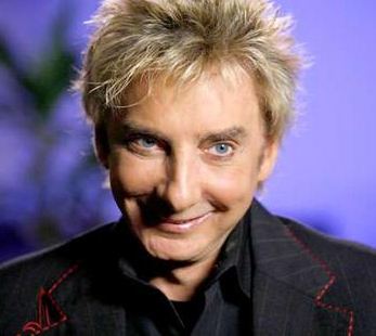 Barry Manilow. Has-been singer from the 70s. Looks like Clay Aiken, Lance Bass, and lesbian Jane Lynch.