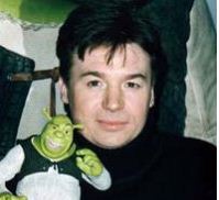 Mike Meyers. Anyone who doesn't want to look like a woman, should avoid turtle necks at all costs, and shaved eyebrows. Kind of a K.D. Lang fetish going on there.