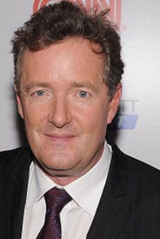 Piers Morgan. British. Soft-talking. Scared to death of guns. --Yep, he's a woman for sure.