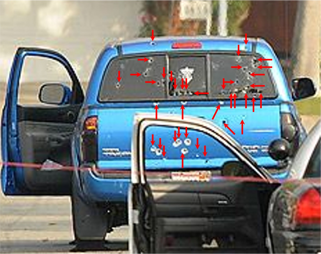 Two women shot delivering newspapers, I count 39 bullet holes, attempted murder by L.A. cops? They also shot up a 2nd look alike truck. Maybe Dorner is right after all?