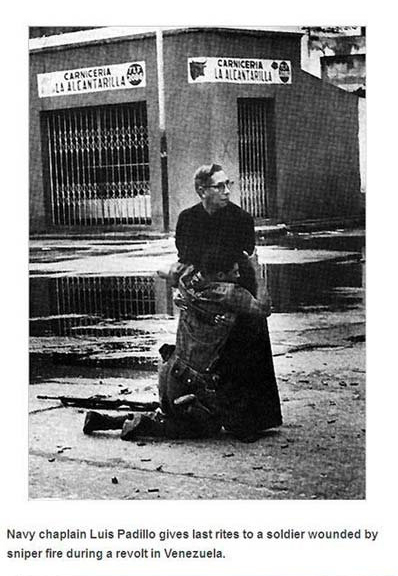 priest soldier - P I Laallantoilu Shrniceria Carniceria L! Hlcantarillas Navy chaplain Luis Padillo gives last rites to a soldier wounded by sniper fire during a revolt in Venezuela.