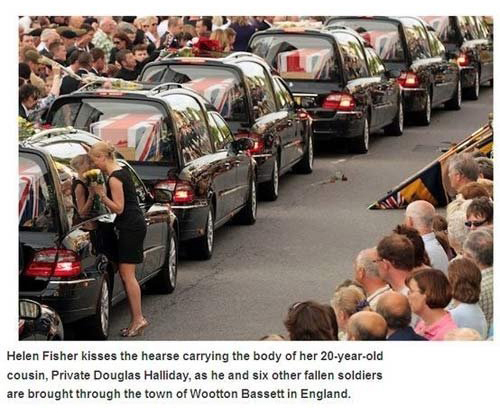 right in the feels - Helen Fisher kisses the hearse carrying the body of her 20yearold cousin, Private Douglas Halliday, as he and six other fallen soldiers are brought through the town of Wootton Bassett in England.