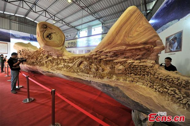 It's intricately carved in a way that implies all 4 of the years of the effort that it Zheng Chunhi to finish it. Having started in 2009, artist Zheng Chunhui finished just this year.