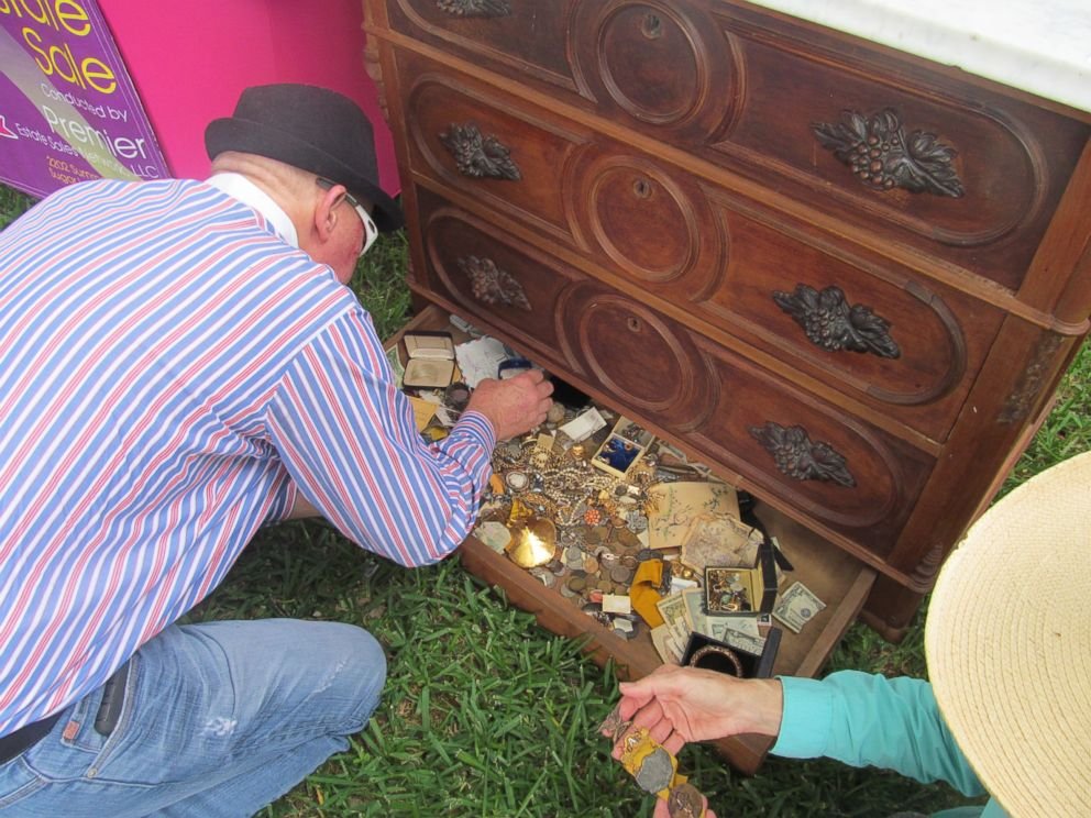 But when he and a staff person from Premiere Estate Sales Network tried to load the piece of furniture into a vehicle, they heard moving metal jingling inside. They decided to jimmy open the bottom drawer.