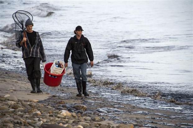 The spill was discovered when people reported a foul smell near a state beach Tuesday afternoon. Authorities found a half-mile slick in the Pacific Ocean that later spread to four miles