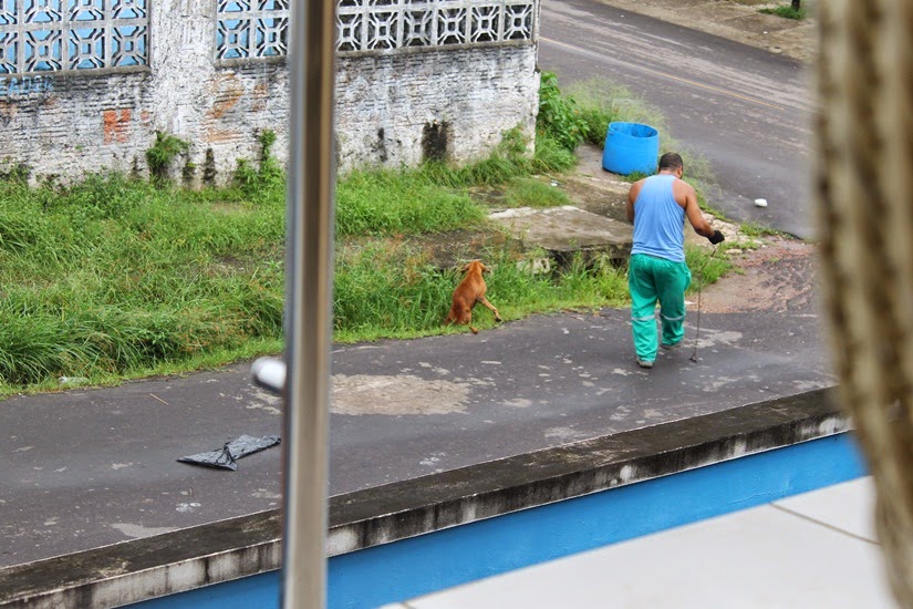 He laughed as he pulled it along the pavement and into the back of the lorry.