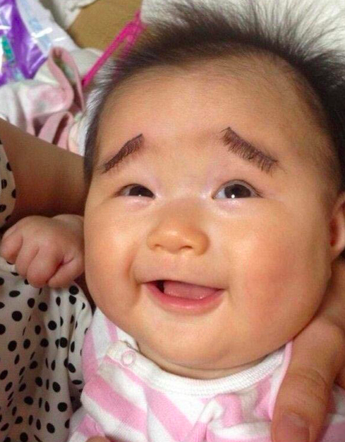 baby with fake eyelashes