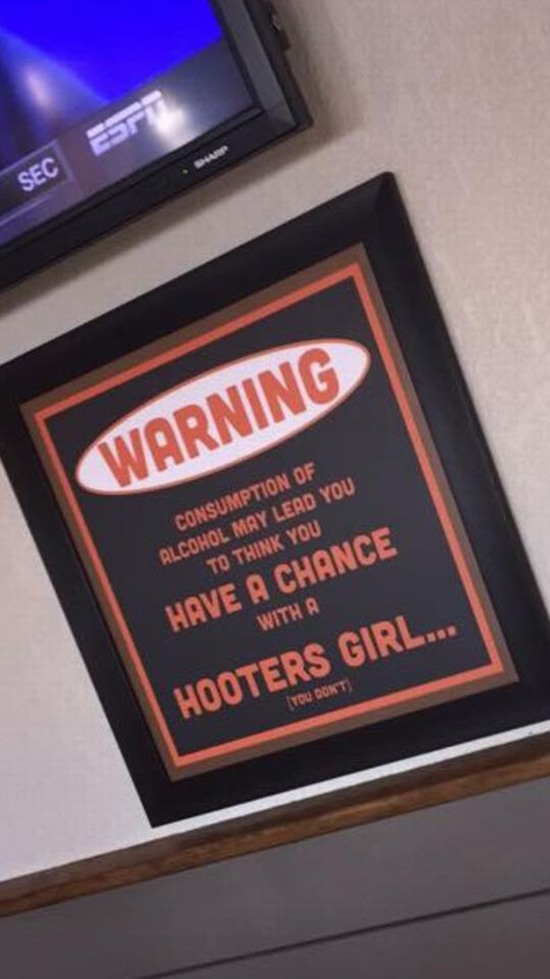 funny picture of a sign on the wall at hooters